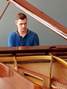 Reuben Morgan plays his composition "Mother Earth" during the Weathering the Future launch.